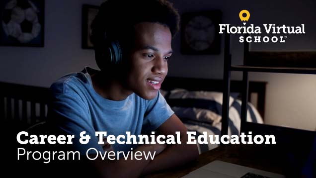 Student listening to course on computer with headphones on