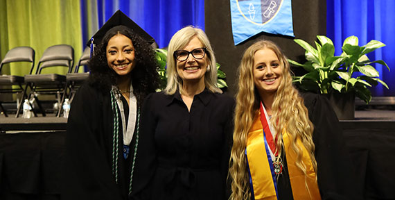 Principal Suzanna Pacheco with graduates