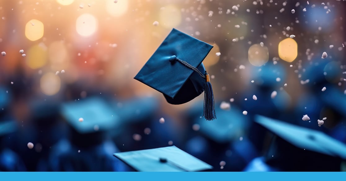 Graduation cap thrown in the air for recognition for the top online students of 2024