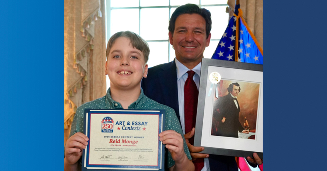 FLVS Flex student, Reid Monge, stands with Florida Gov. Ron DeSantis, while holding his award for winning the America250FL essay contest.