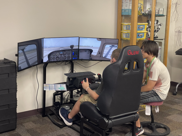 Students get to experience what it's like to land a plane during the STEM Camp